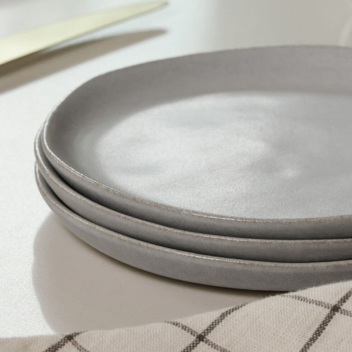 Salad plates dinnerware by Fable Home, shown in a stoneblue finish 2. – #stoneblue
