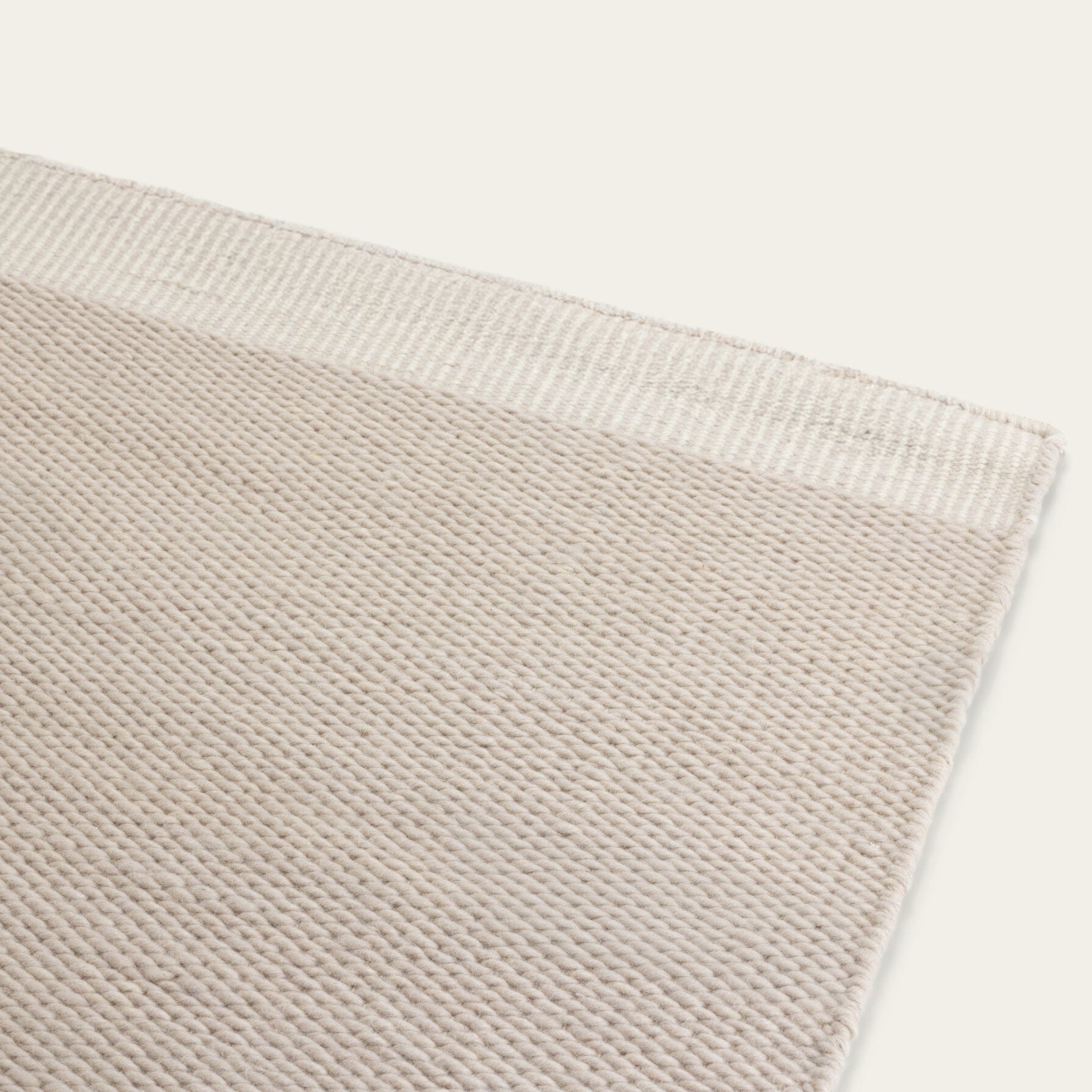 Close-up of a Dune gray wool rug showing the texture and weave. #dunegray